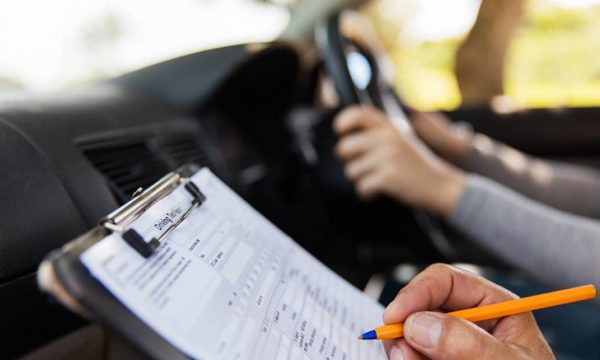 Driving-Test-Instructor-Writing-1-1068x623-600x360-1