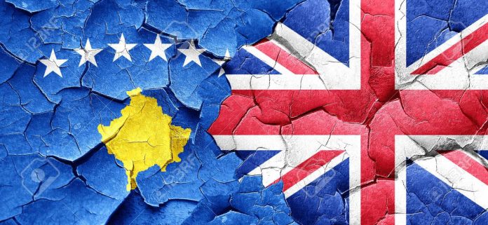 Kosovo flag with Great Britain flag on a grunge cracked wall